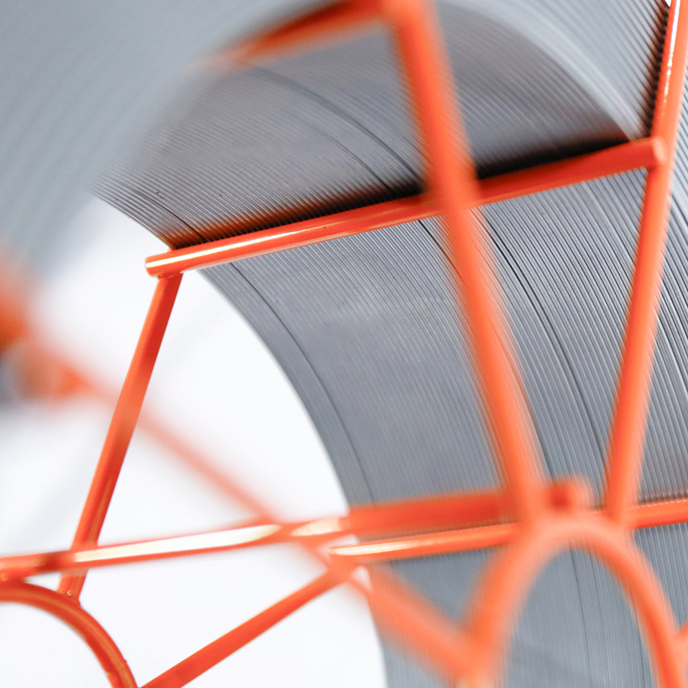 Non-copper coated ER70S-6 welding wire spool with orange metal frame